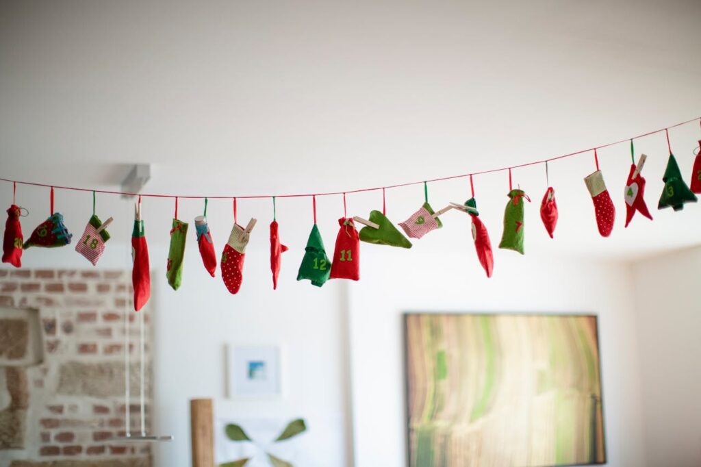 Christmas Stocking and Ornaments Hanging on a Red String