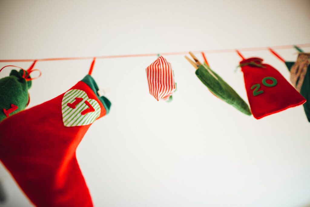 Christmas Stocking and Ornaments Hanging on a Red String