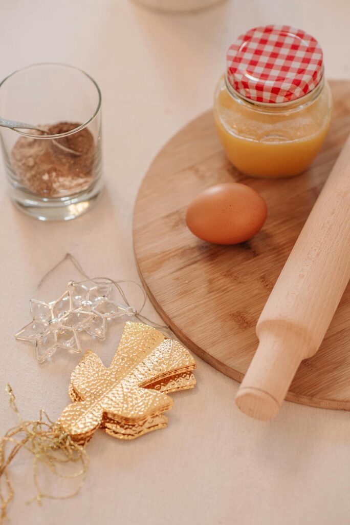 Clear Drinking Glass With Orange Juice on Brown Wooden Table
