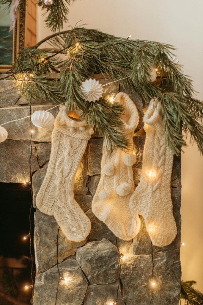 White Socks Hanging on a Fireplace
