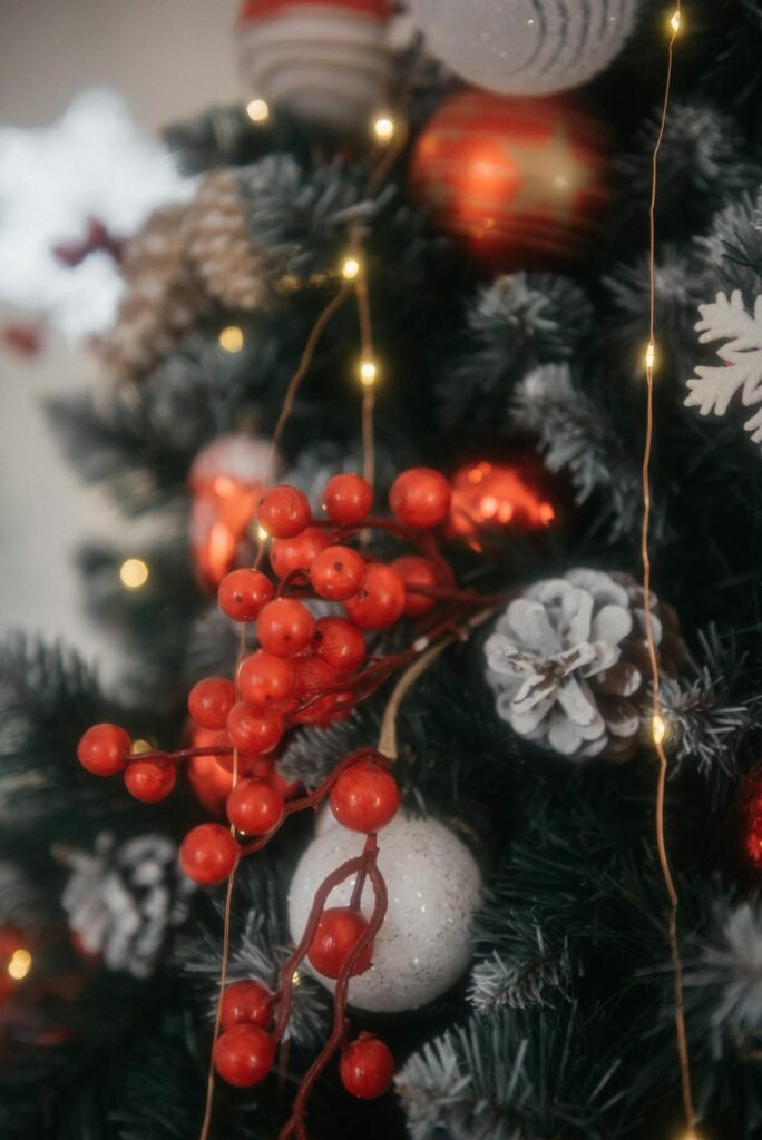 Festive Christmas Tree with Berries and Lights
